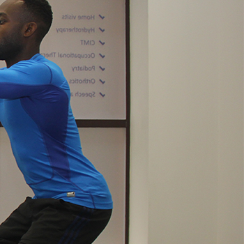 Lady stretching whilst using resistance bands